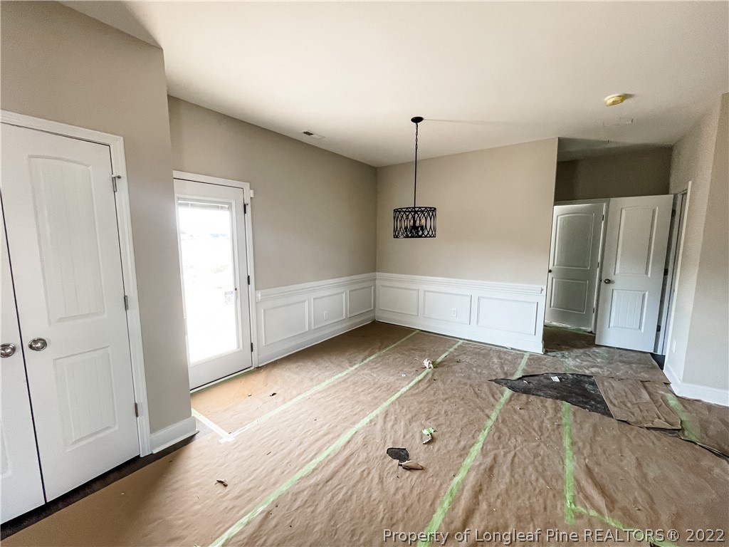 185 Winnsboro (lt113) Road Raeford, NC 28376 - Photo 6 of 19 a view of a refrigerator in kitchen and wooden floor