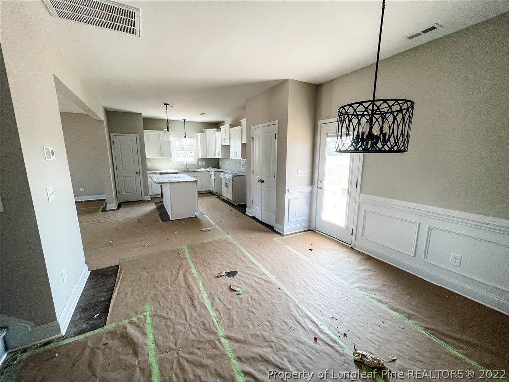 185 Winnsboro (lt113) Road Raeford, NC 28376 - Photo 10 of 19 a view of a room with window and hardwood floor