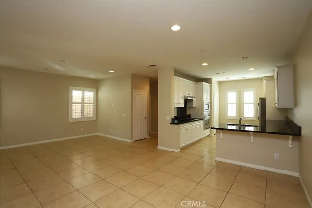 a view of a kitchen with furniture and a window