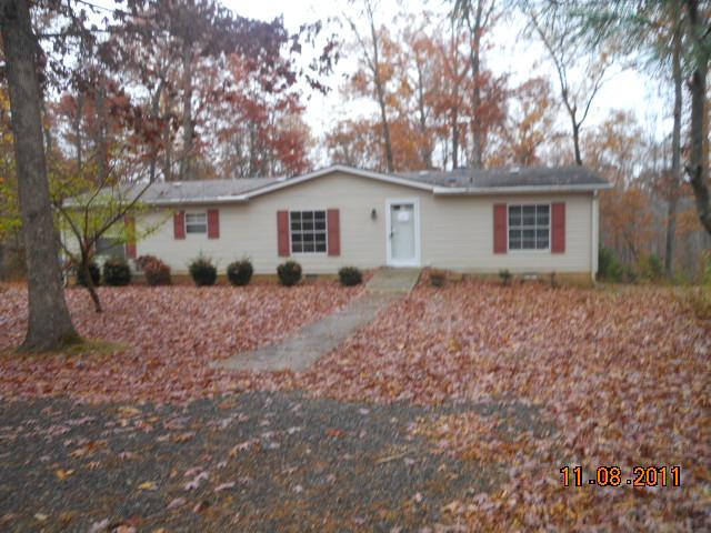 9139 East 40 Road Bon Aqua, TN 37025 - Photo 2 of 11 FRONT L, HAS TREES IN FRONT YARD