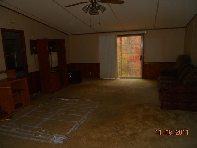 9139 East 40 Road Bon Aqua, TN 37025 - Photo 9 of 11 LIVING ROOM WITH PATIO DOORS ON BACK