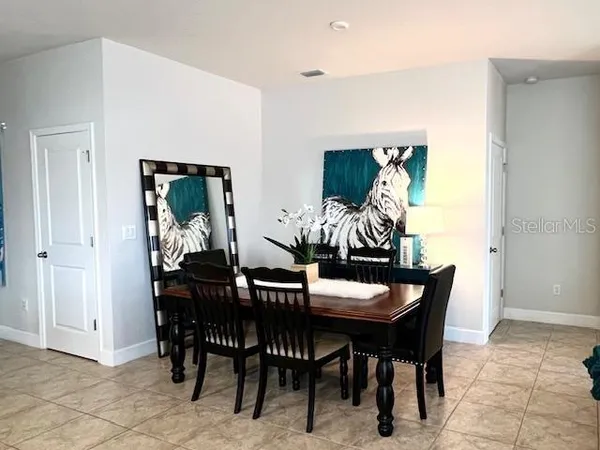 a view of a dining room with furniture