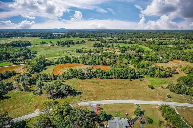 a view of a field with an ocean