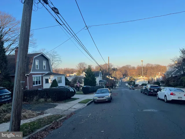 a view of a car parked in front of a house