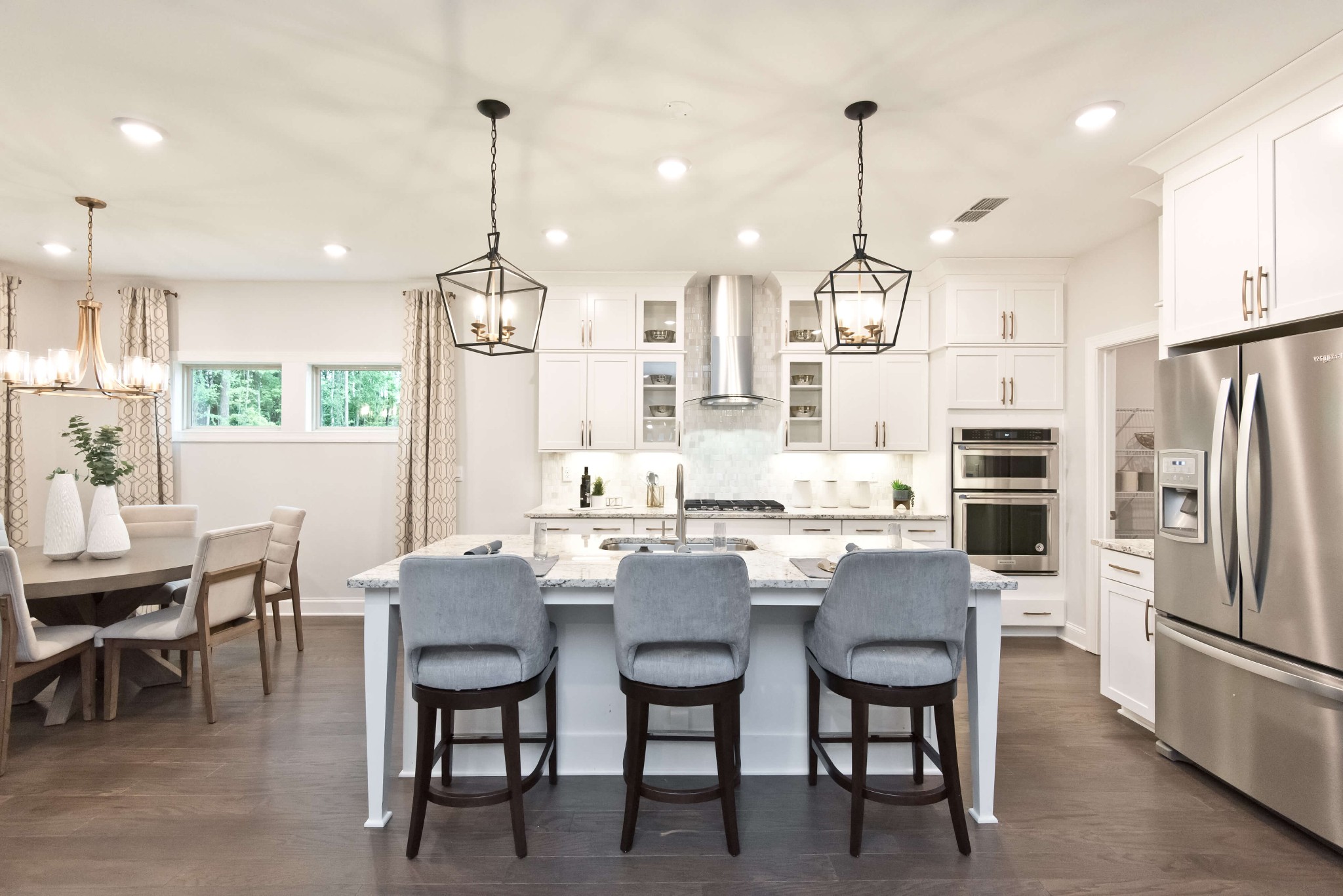 711 Castle Road Mount Juliet, TN 37122 - Photo 4 of 19 a kitchen with refrigerator and chairs