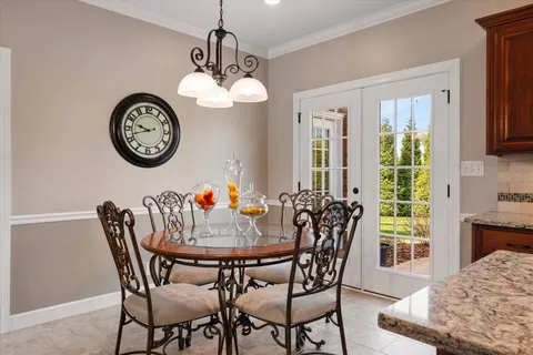 a bathroom with a sink double vanity granite and a bathtub