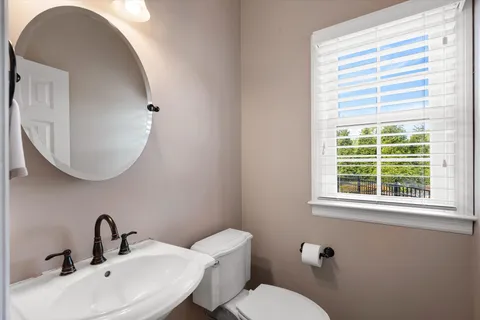 a bed room with a bed and a window