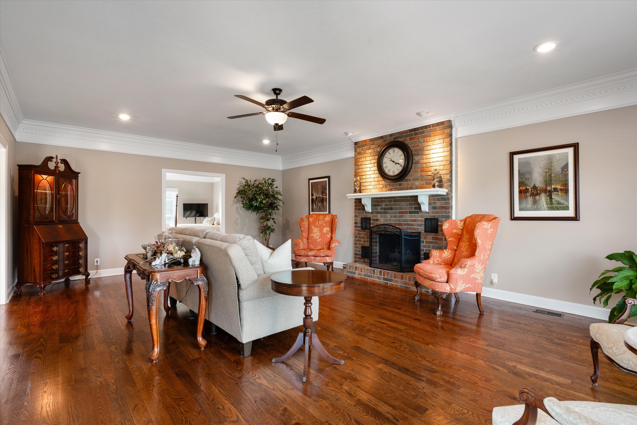 506 Pond Apple Road Clarksville, TN 37043 - Photo 26 of 73 a living room with furniture a fireplace a clock and a window