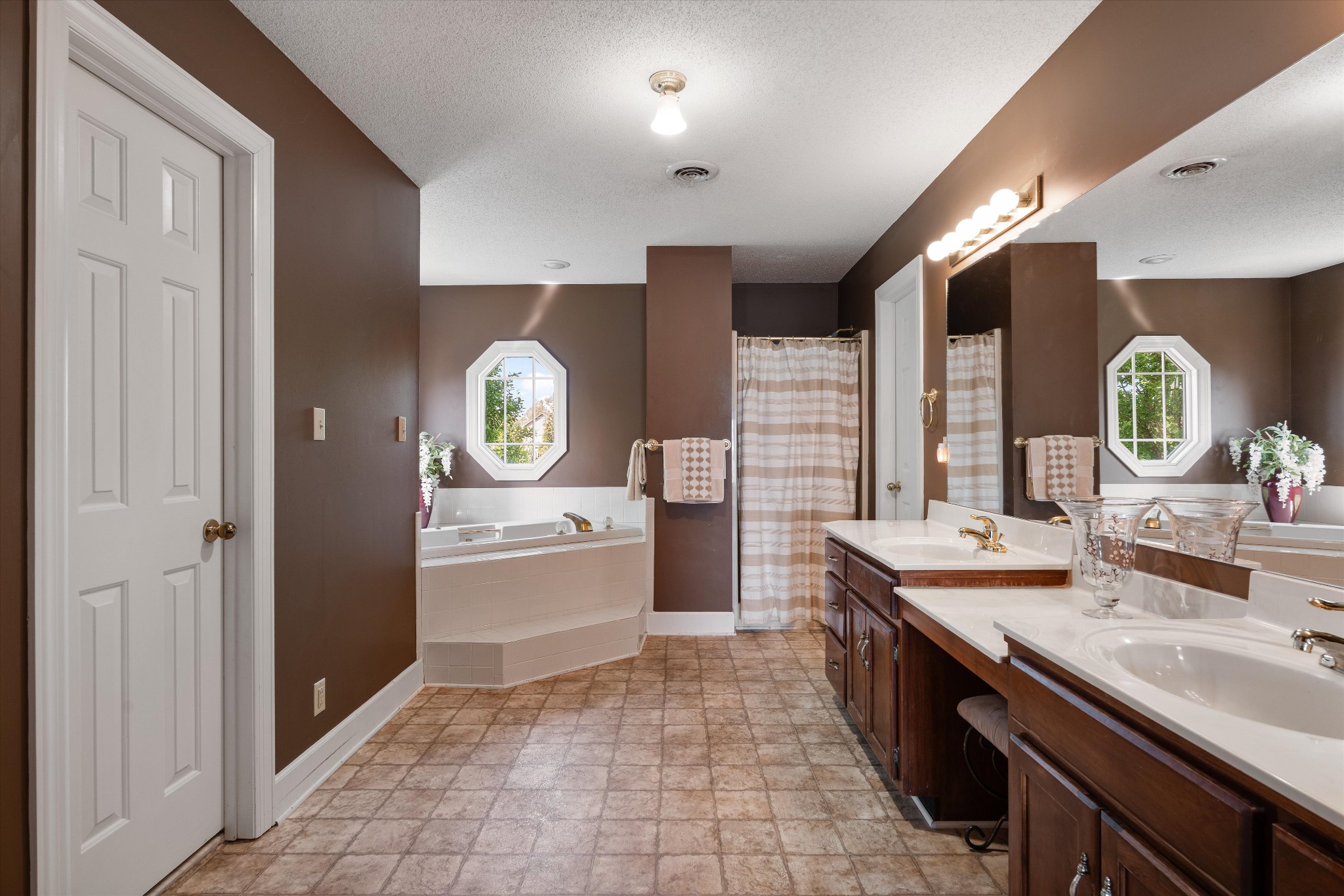 506 Pond Apple Road Clarksville, TN 37043 - Photo 29 of 73 a large bathroom with a granite countertop double vanity sink a mirror and a bathtub