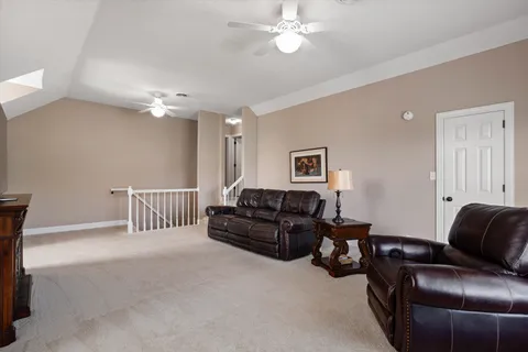 a front view of a house with a yard fire pit and outdoor seating