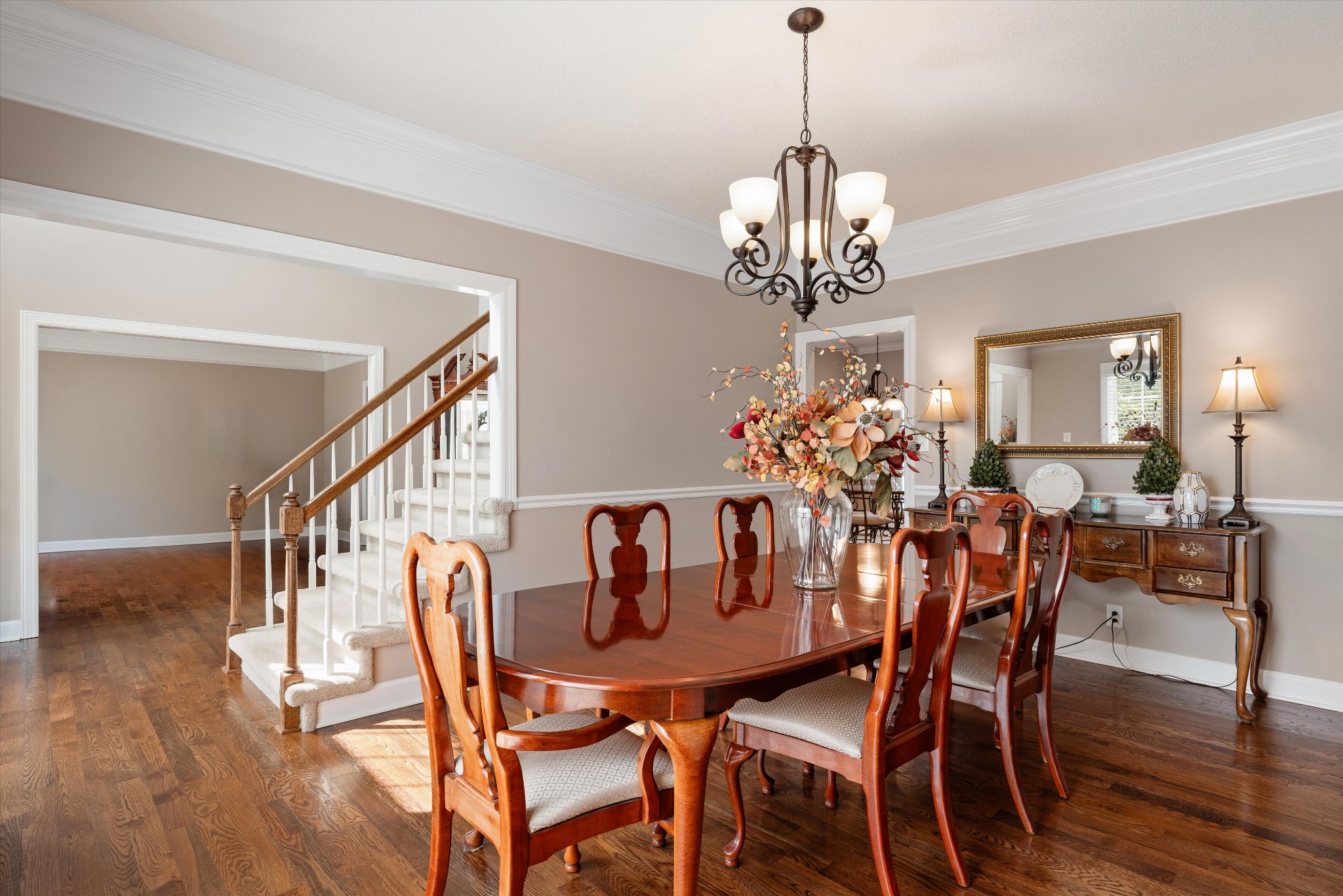 506 Pond Apple Road Clarksville, TN 37043 - Photo 9 of 73 a view of a dining room with furniture a chandelier and wooden floor
