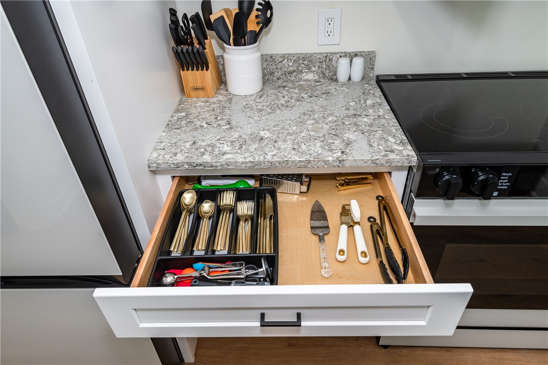 1915 Patterson Road Dayton, OH 45420 - Photo 21 of 48 This modern kitchen features sleek countertops and efficient storage solutions for culinary enthusiasts.