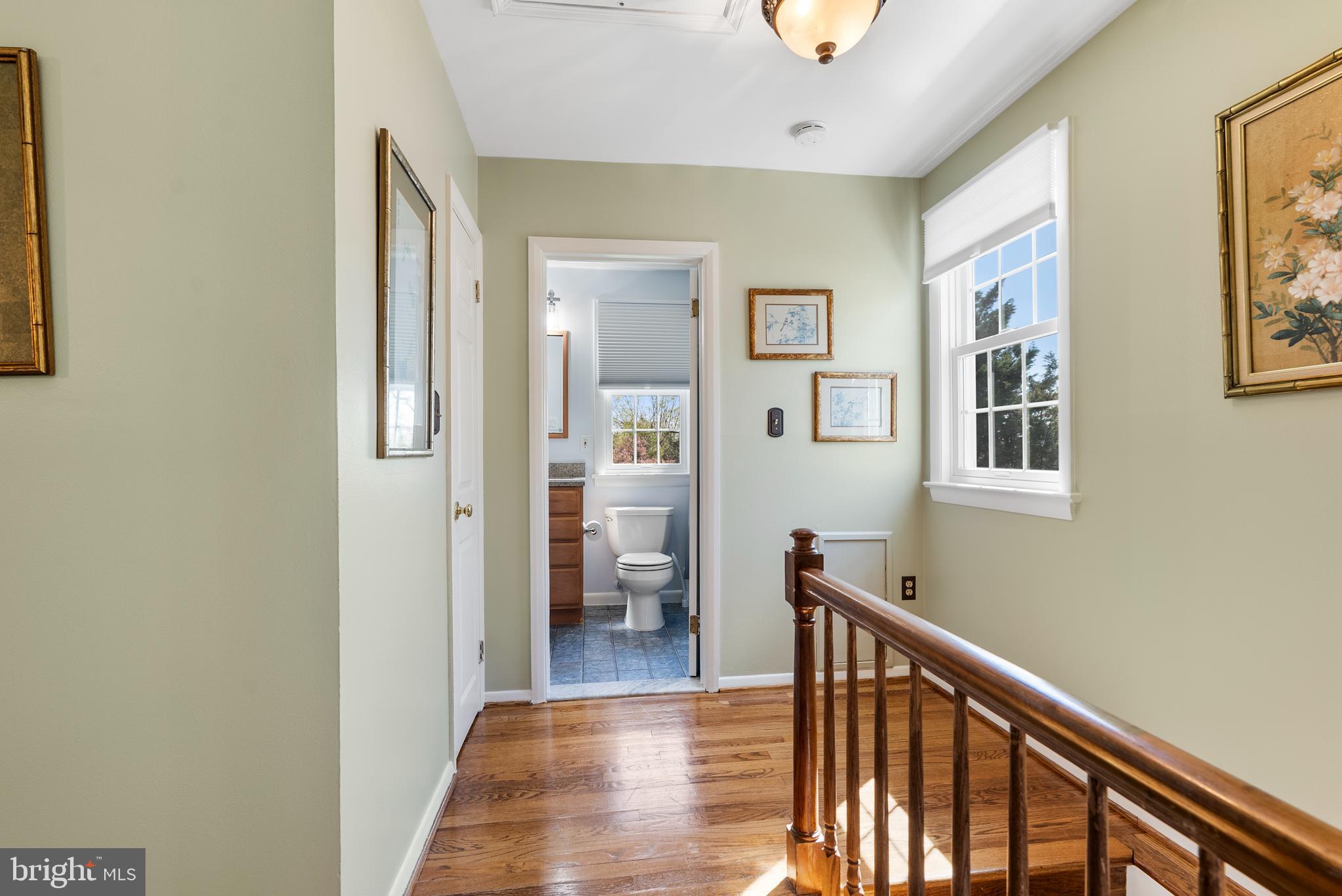 907 Arran Road Baltimore, MD 21239 - Photo 19 of 41 a view of a hallway with windows and hardwood floor