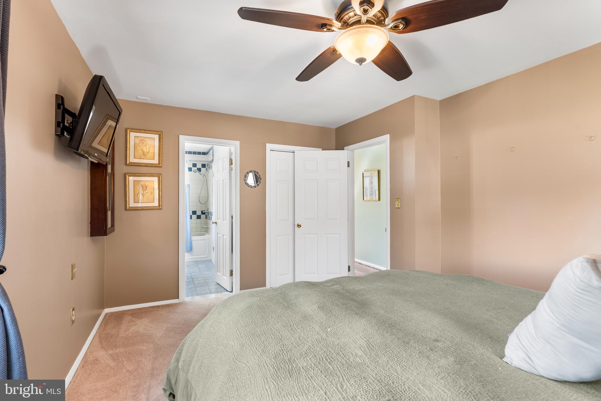 907 Arran Road Baltimore, MD 21239 - Photo 21 of 41 a bedroom with a bed and a chandelier