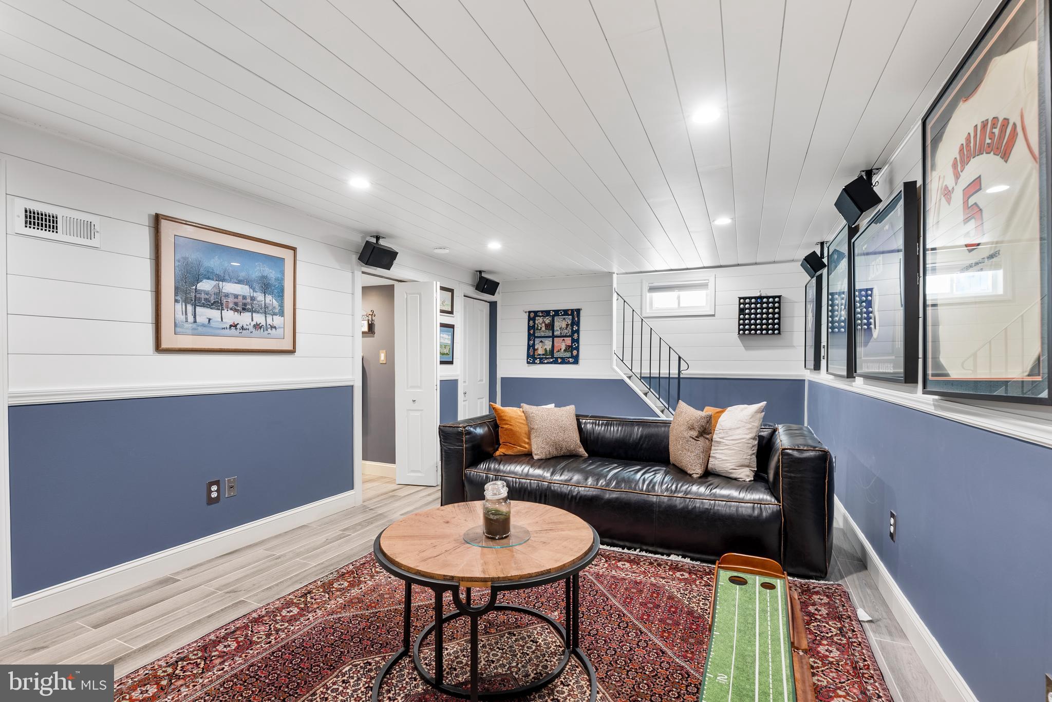 907 Arran Road Baltimore, MD 21239 - Photo 27 of 41 a living room with furniture and a rug