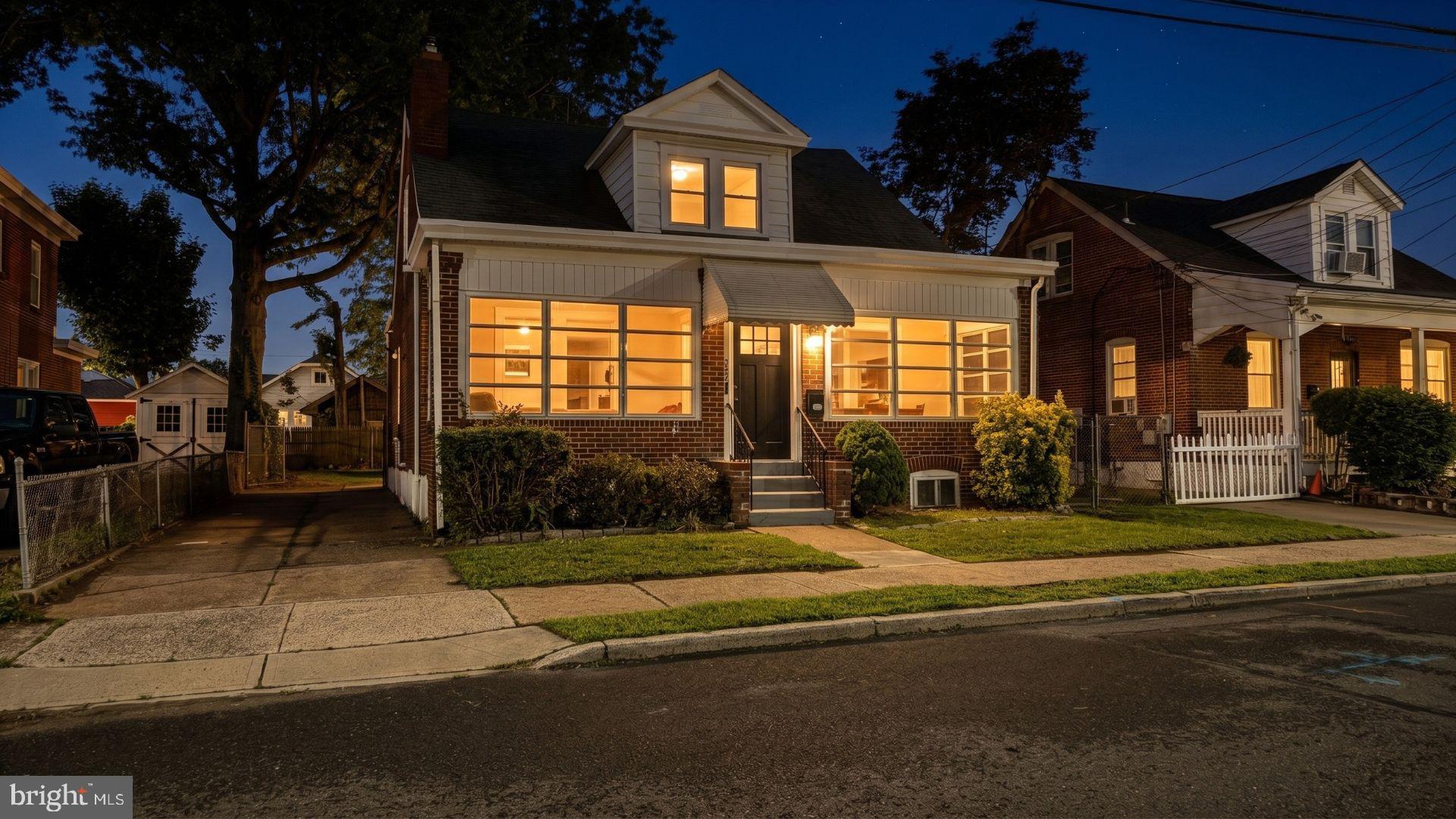 154 Andrew Street Hamilton, NJ 08610 - Photo 29 of 29 a view of a house with a large windows and a yard