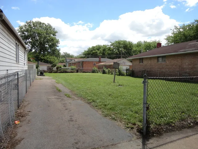 a view of a backyard with grass