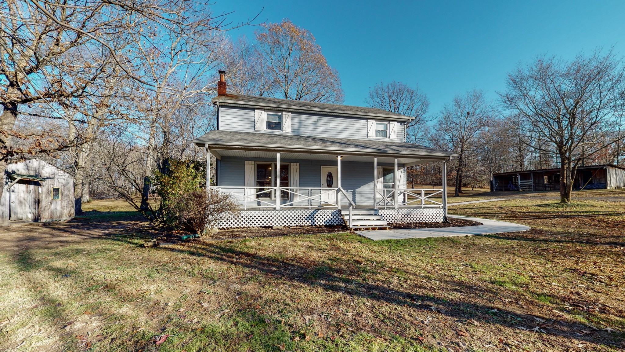 1225 Manley Loop Dickson, TN 37055 - Photo 2 of 50 a front view of house with yard outdoor seating and barbeque oven