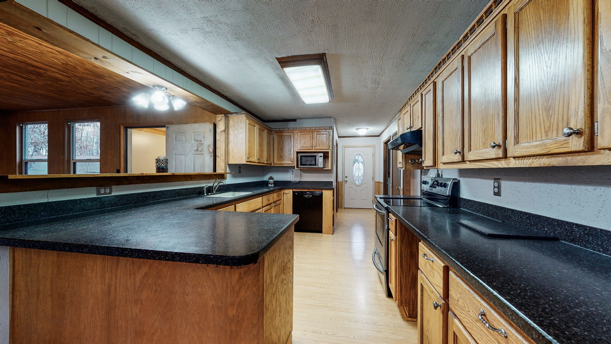 1225 Manley Loop Dickson, TN 37055 - Photo 17 of 50 a large kitchen with stainless steel appliances granite countertop a sink a stove and a refrigerator