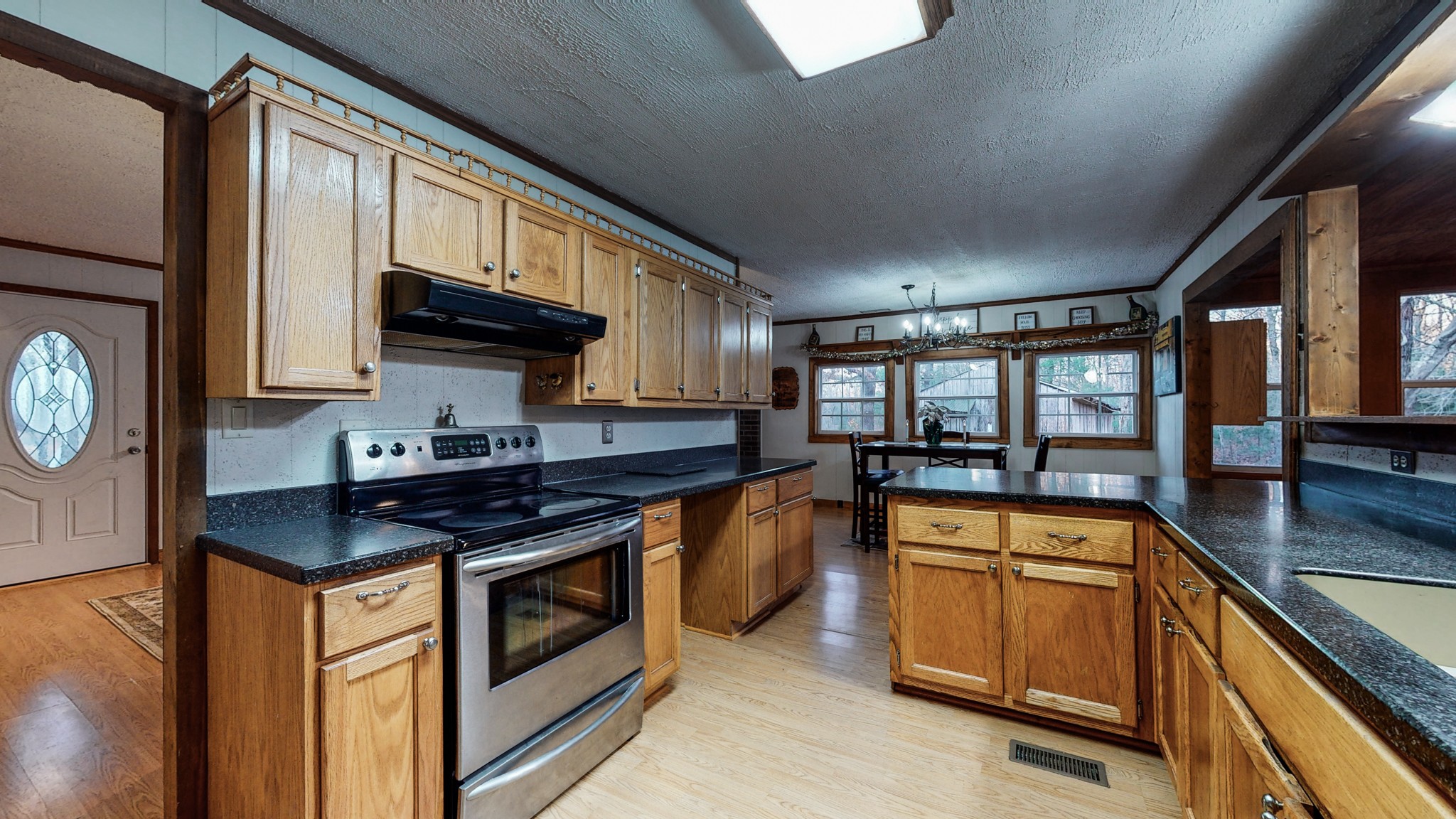 1225 Manley Loop Dickson, TN 37055 - Photo 19 of 50 a kitchen with stainless steel appliances granite countertop a stove and a sink