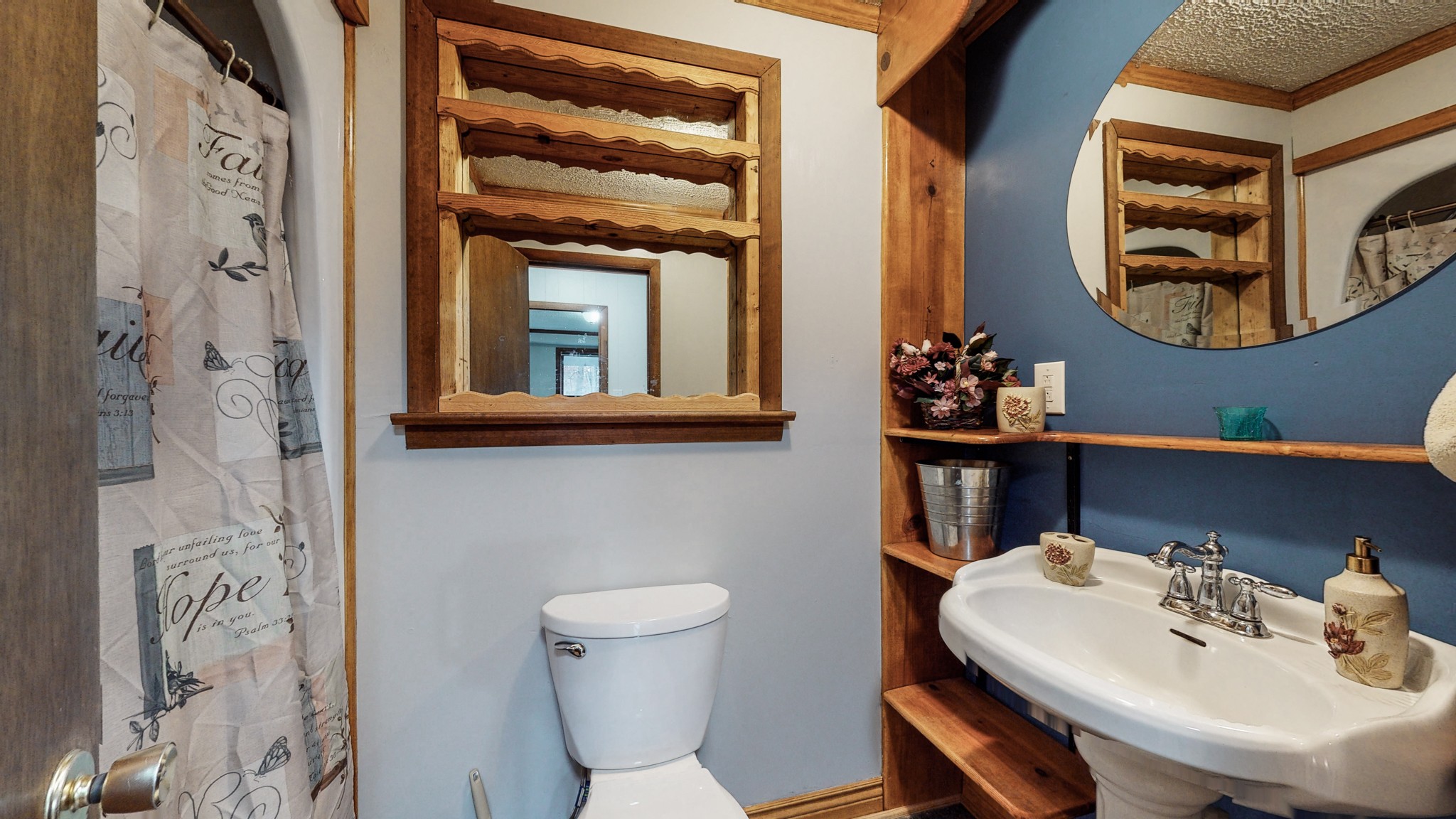 1225 Manley Loop Dickson, TN 37055 - Photo 22 of 50 a bathroom with a sink and a mirror with painted walls