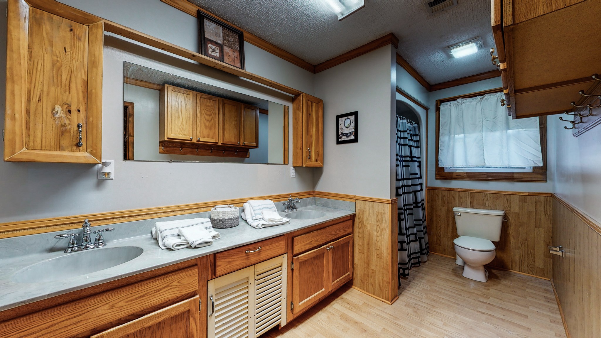 1225 Manley Loop Dickson, TN 37055 - Photo 23 of 50 a bathroom with a granite countertop sink a toilet and a mirror