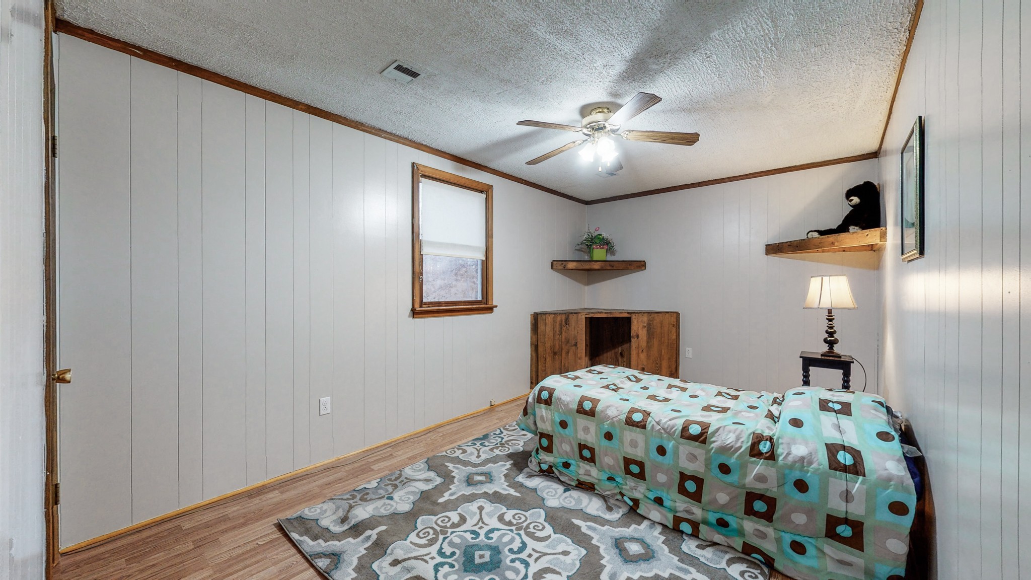 1225 Manley Loop Dickson, TN 37055 - Photo 26 of 50 a bedroom with a bed and a chandelier
