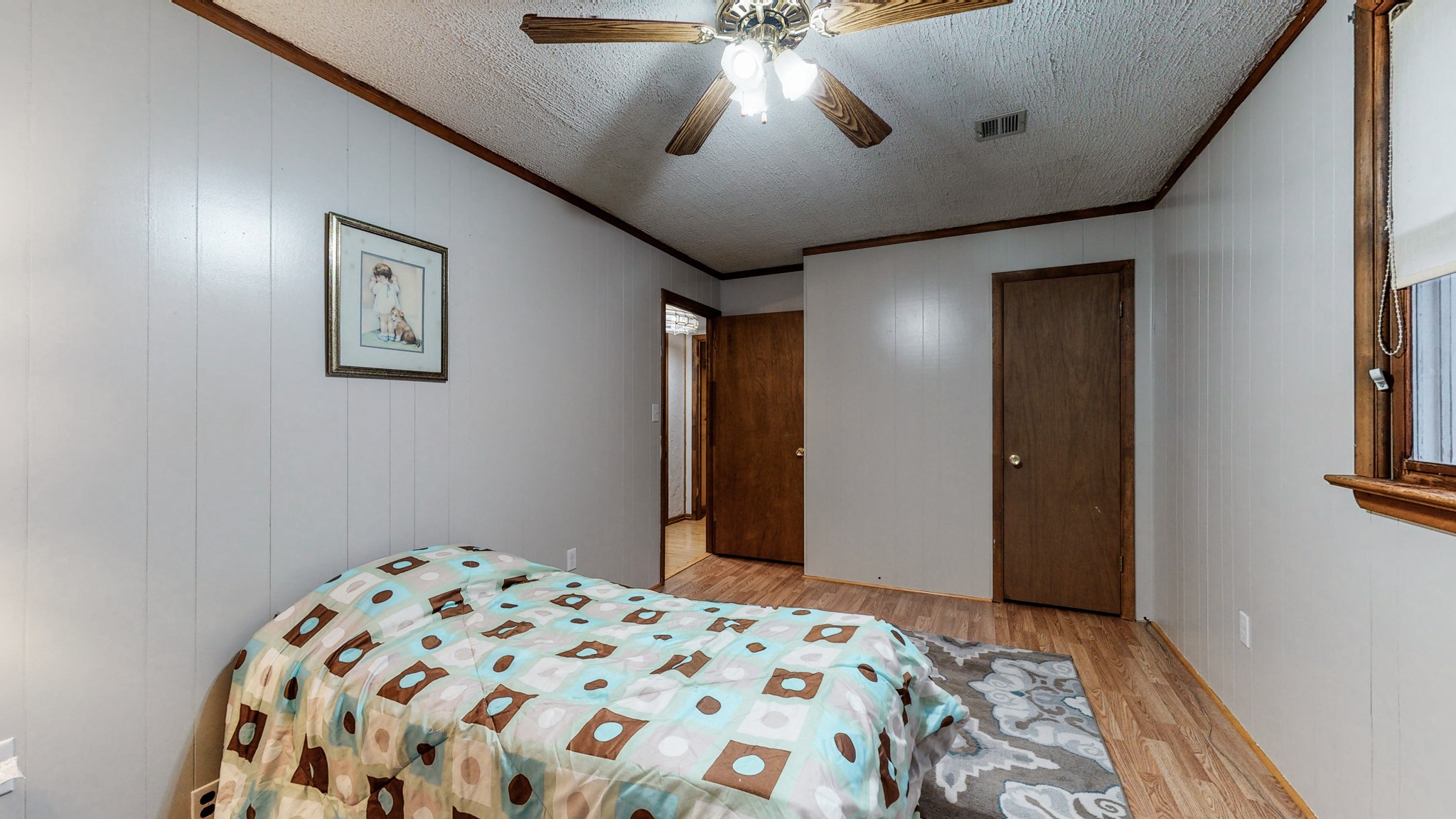 1225 Manley Loop Dickson, TN 37055 - Photo 27 of 50 a bedroom with a bed and a chandelier