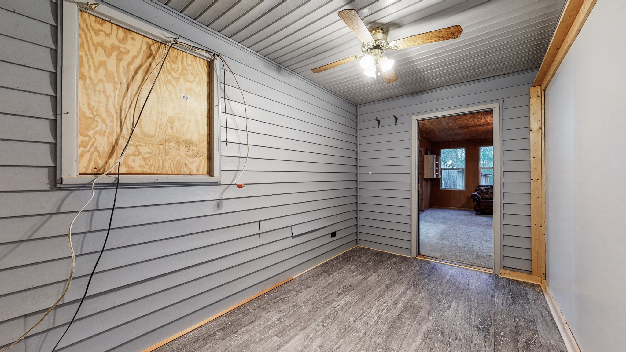 1225 Manley Loop Dickson, TN 37055 - Photo 31 of 50 a view of a porch with wooden floor and a door