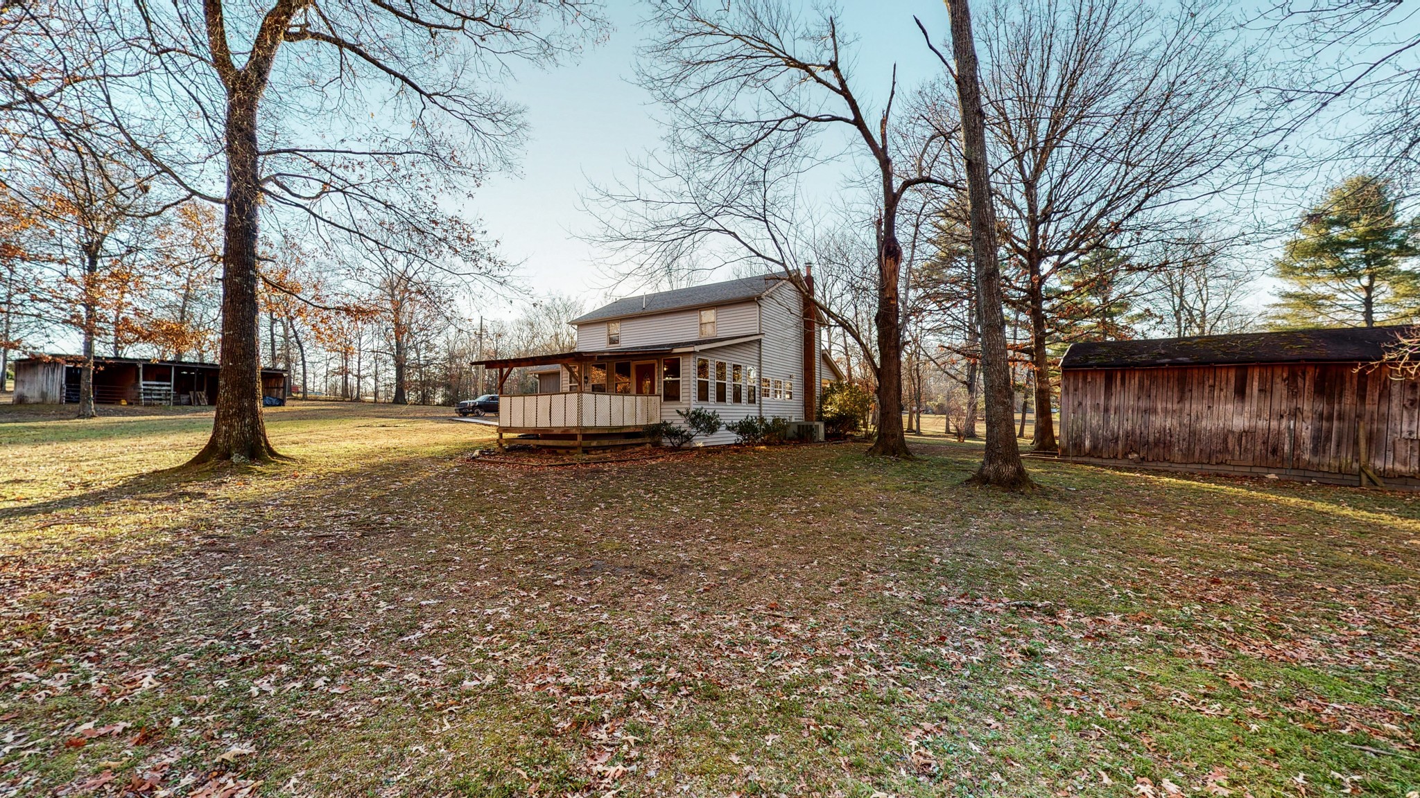 1225 Manley Loop Dickson, TN 37055 - Photo 46 of 50 a view of a yard with a house and a large tree