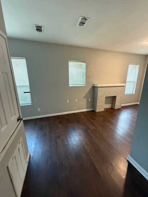 1507 7th Street Corpus Christi, TX 78404 - Photo 6 of 9 an empty room with wooden floor and windows
