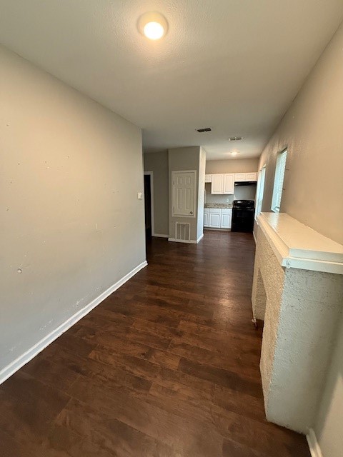 1507 7th Street Corpus Christi, TX 78404 - Photo 7 of 9 a view of a livingroom with furniture and an empty room