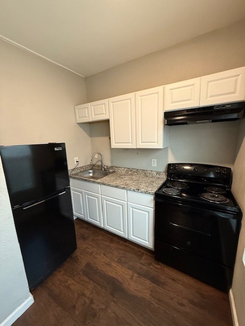 1507 7th Street Corpus Christi, TX 78404 - Photo 8 of 9 a kitchen with a sink stove and refrigerator