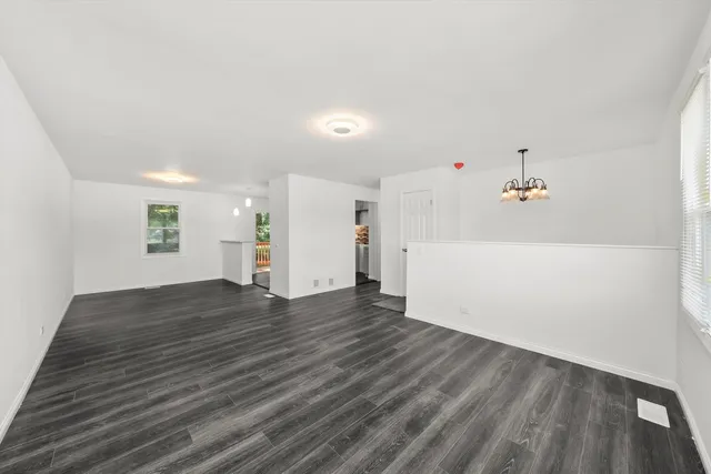a view of a livingroom with wooden floor