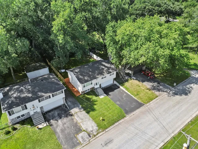 a view of house with yard