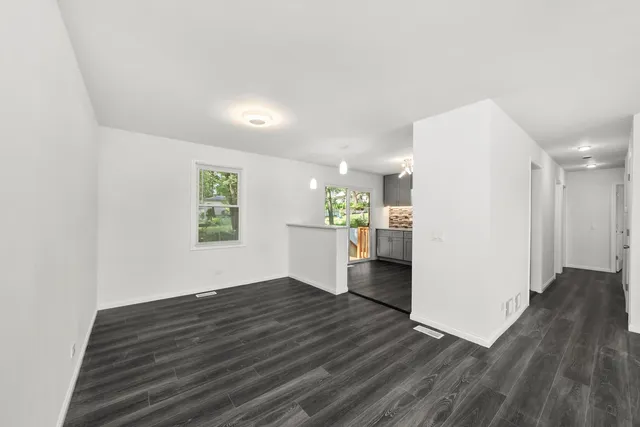 a view of kitchen and wooden floor