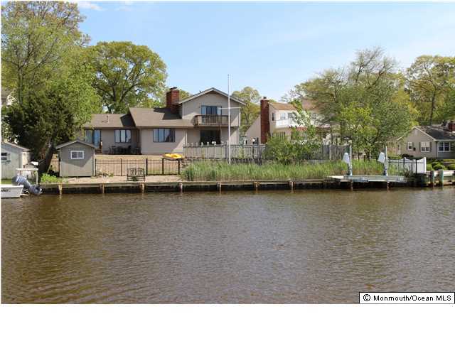 546 Harbor Road Brick, NJ 08724 - Photo 4 of 10 a view of a lake with houses