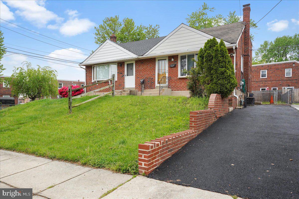 1107 Haverford Road Ridley Park, PA 19078 - Photo 1 of 17 a front view of a house with a yard