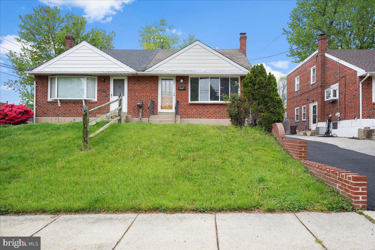 1107 Haverford Road Ridley Park, PA 19078 - Photo 17 of 17 a front view of a house with garden