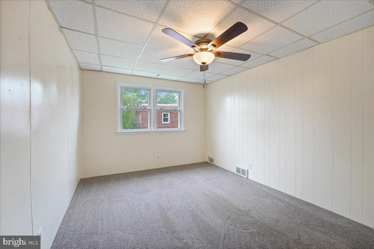 1107 Haverford Road Ridley Park, PA 19078 - Photo 6 of 17 an empty room with windows and fan