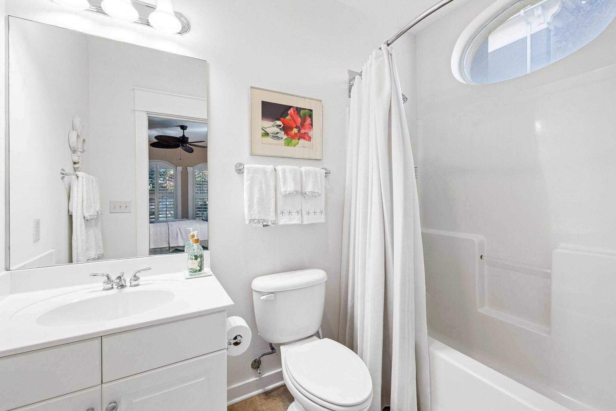 4545 East County Highway 30A, Unit B202 Santa Rosa Beach, FL 32459 - Photo 18 of 42 a bathroom with a sink mirror vanity and toilet