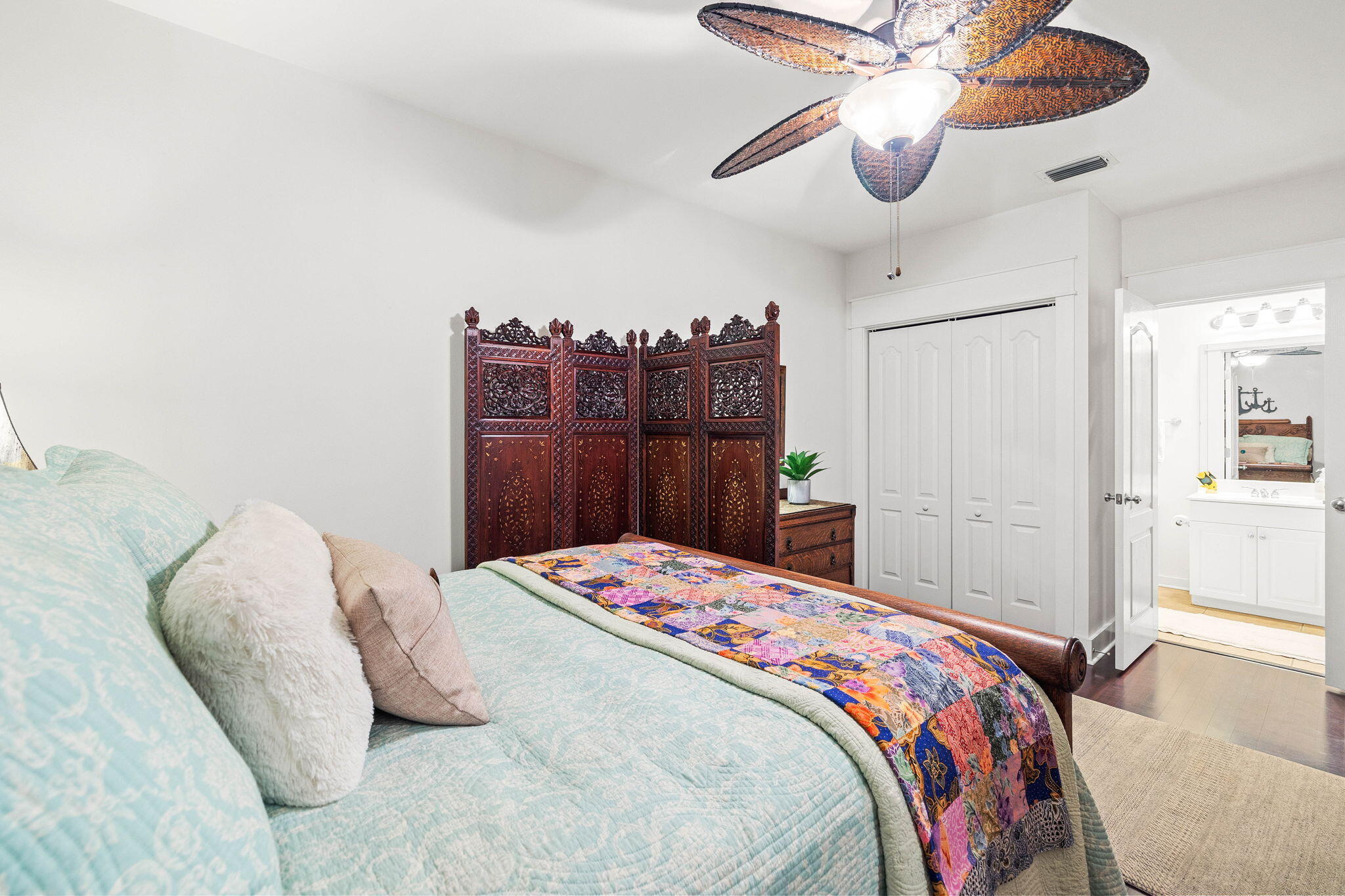 4545 East County Highway 30A, Unit B202 Santa Rosa Beach, FL 32459 - Photo 19 of 42 a bedroom that has a bed and a chandelier