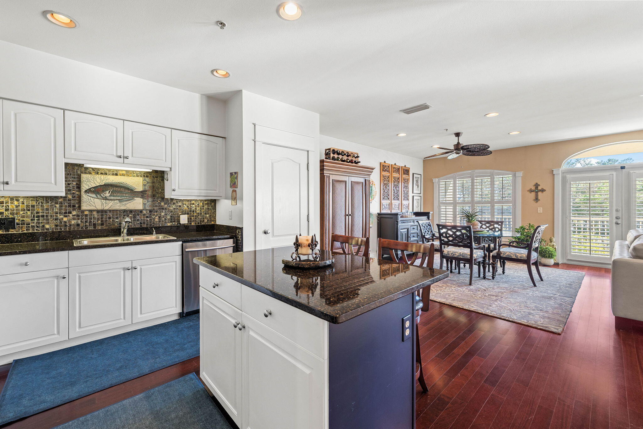 4545 East County Highway 30A, Unit B202 Santa Rosa Beach, FL 32459 - Photo 26 of 42 a kitchen with counter space cabinets appliances and wooden floor
