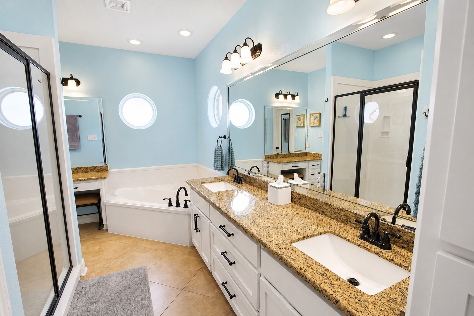 7502 Lewis Lane Manvel, TX 77578 - Photo 23 of 50 The primary ensuite bathroom is quite large and features a separate vanity area around the corner.