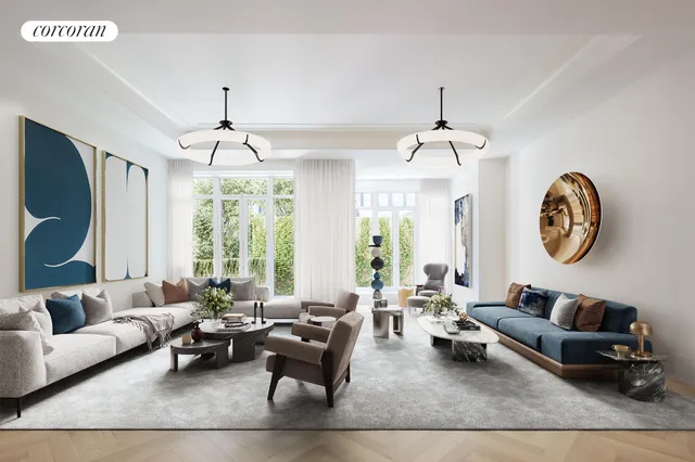 a living room with furniture a window and a chandelier