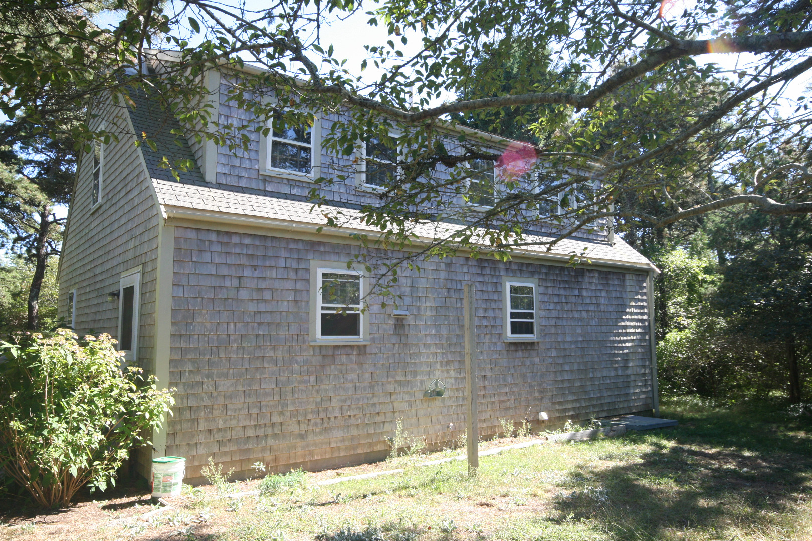 45 Fairgrounds Road Nantucket, MA 02554 - Photo 4 of 9 a front view of a house with a yard