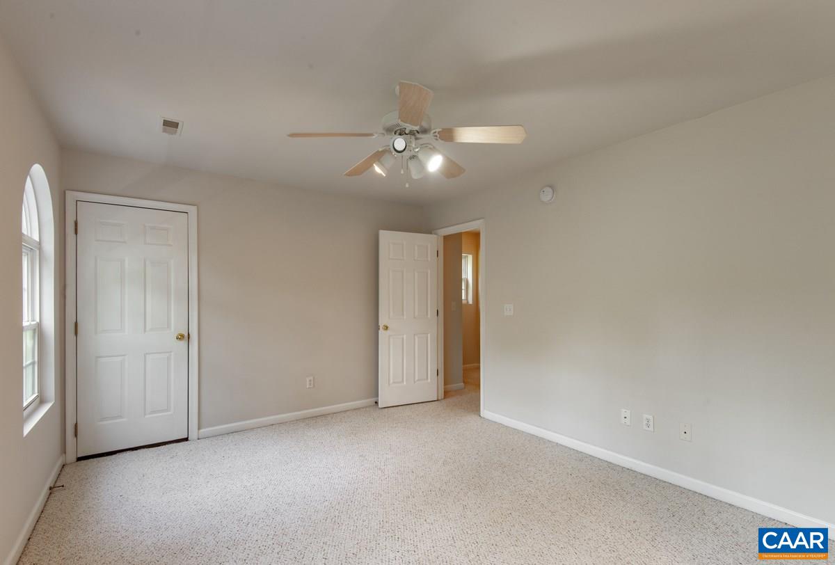 3 Bernardsburg Road Palmyra, VA 22963 - Photo 16 of 38 an empty room with a ceiling fan and a window