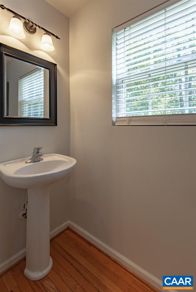 3 Bernardsburg Road Palmyra, VA 22963 - Photo 18 of 38 a bathroom with a sink a mirror and a window