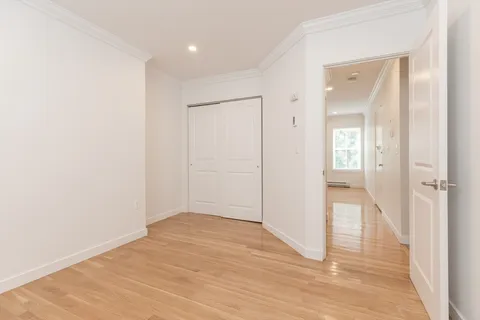 wooden floor in a hall with an entryway