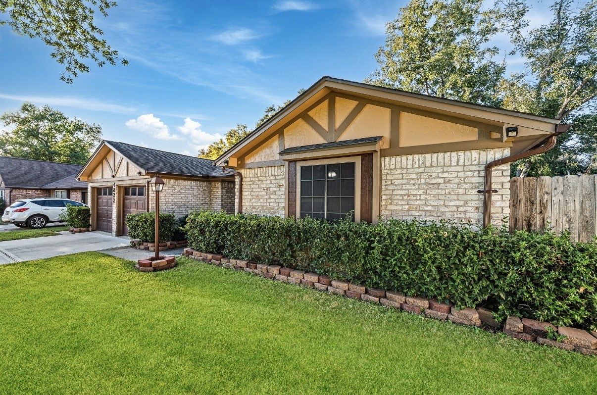 4822 Lost Oak Drive Spring, TX 77388 - Photo 2 of 14 a front view of a house with garden
